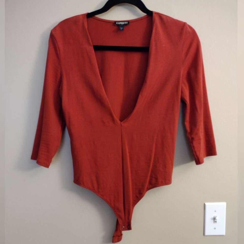 Express Deep brown orange (pumpkin) quar sleeved bodysuit with deep V neckline